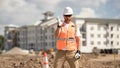 Bilder man in hardhat. Construction man with helmet. Industry worker at construction building. Engineer man builder