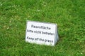 Bilingual keep of the grass sign in Germany