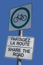 Bilingual share the road sign