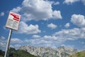 Bilingual sign, Italian and English, indicating the helicopter landing area for mountain rescue