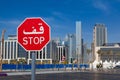 Bilingual stop sign in Dubai with both arabic and latin writing.