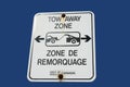 Bilingual tow away zone sign