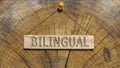 Bilingual written on wooden surface. Wooden Concept Royalty Free Stock Photo