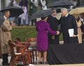 Bill Clinton shakes hands with Laura Bush Royalty Free Stock Photo