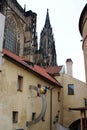 Prague, Czech Republic, January 2015. Billboard cafe on the medieval house and view of the St. Vitus Cathedral.