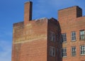 Billboard painted on the side of an abandoned hotel