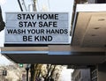 Billboard reads stay home, stay safe, wash your hands abd be ind