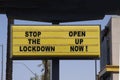 Billboard saying Stop the Lockdown - Open Up Now! Anti-lockdown protests