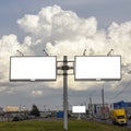 Billboards for advertising, text, illustrations and pictures on a background of beautiful thick clouds near the road