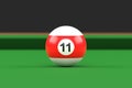 Billiard ball number eleven in red and white color on billiard table Royalty Free Stock Photo