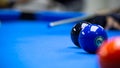 Billiard balls in a blue pool table Royalty Free Stock Photo