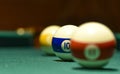 Billiard balls and cue on the pool table Royalty Free Stock Photo