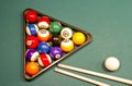 Billiard balls on green pool table