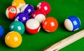 Billiard balls on green table with billiard cue, Snooker, Pool. Royalty Free Stock Photo