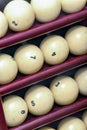 Billiard balls made of ivory on a wooden stock