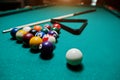 Billiard balls in a pool table at triangle with billiard cue Royalty Free Stock Photo