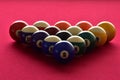 Billiard balls on a red felt pool table