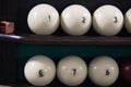 Billiard balls on the shelf stand and chalk whiten the tip of the cue. for playing Russian Billiards.