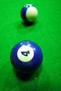 Billiard balls on table. Balls on green billiard table. Number 4.