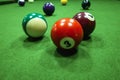 Billiard balls on table. Balls on green billiard table. Number 3 and 7.