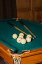 Billiard cue and balls on a green table Royalty Free Stock Photo