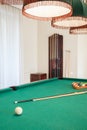 Billiard cue on billiard table Royalty Free Stock Photo