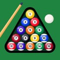 Billiard cue and pool balls in triangle on green table. Billiard balls, triangle and pool stick for game on green table top view. Royalty Free Stock Photo