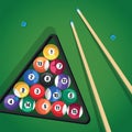 Billiard cue and pool balls in triangle on green table while game. Biliard balls, triangle and pool stick for game on