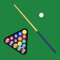 Billiard cue and pool balls in triangle on green table. Billiard balls, triangle and pool stick for game on green table top view. Royalty Free Stock Photo