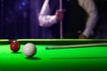 Billiard cue of professional snooker player closeup aiming shot white ball Royalty Free Stock Photo