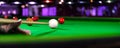 Billiard cue of professional snooker player closeup aiming shot white ball Royalty Free Stock Photo