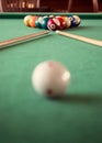 Billiard cues and colored pool balls.