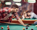 Billiard game - man enjoying playing pool