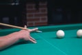 Billiard green table in hall with white balls Royalty Free Stock Photo