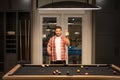 The billiard. Guy Playing billiards. Man hit ball in billiard in Billiard room. Russian pool billiards. Snooker Player Royalty Free Stock Photo