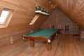 The billiard hall on a mansard floor of the guest house Royalty Free Stock Photo