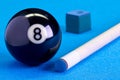 Billiard pool game eight ball with chalk and cue on billiard tab