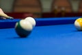 Billiard pool player aims to shoot balls with cue Royalty Free Stock Photo