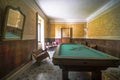 billiard room in abandoned saloon