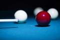 Billiard sport game, red and white balls, cue and pool table Royalty Free Stock Photo