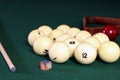 Billiard table with balls, cue, triangle. Green cloth. Playing billiard and pool. Ruusian billiard Royalty Free Stock Photo