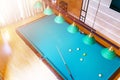 Billiard table close up. Playing billiard. Billiards balls and cue on green billiards table. Billiard sport concept. Pool billiard Royalty Free Stock Photo