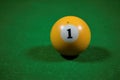 Billiard table with number one yellow balls. billiards background