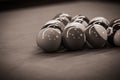 Billiard table setup featuring colorful pool balls, ready for an exciting game of cue sports. Black and white picture