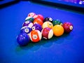 Billiard snooker pyramid balls on pool blue table Royalty Free Stock Photo