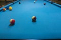 Billiards balls on blue turquois billiards table. Billiard sport concept. Pool billiard game indoor