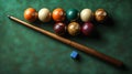 Billiards balls, cue, chalk on green felt table, game setup Royalty Free Stock Photo