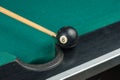 Billiards balls and cue on billiards table. Billiard sport concept