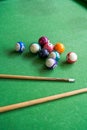 Billiards and pool cues on the pool table