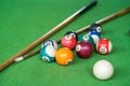 Billiards and pool cues on the pool table